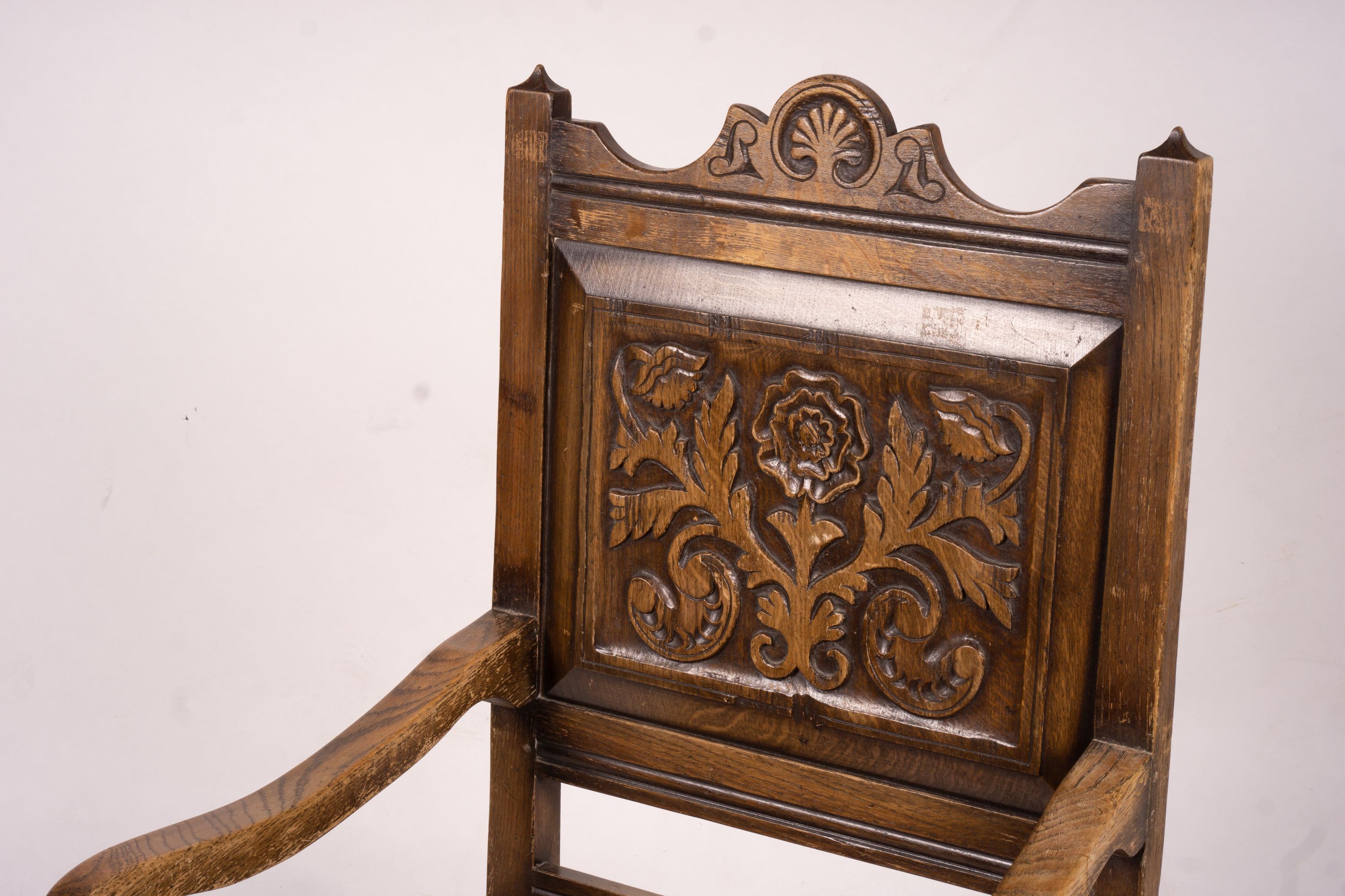 An early 20th century carved oak wainscot chair